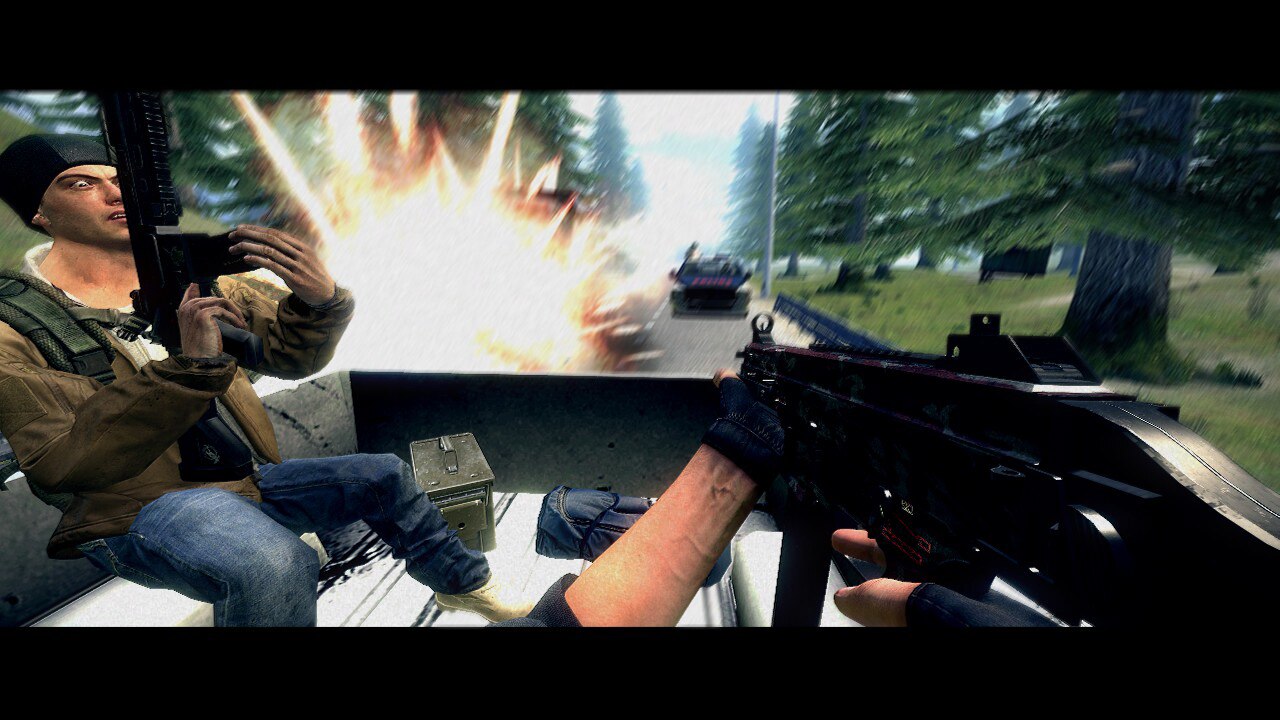 First-person action shot from a vehicle as armed characters drive past an explosion in a forest